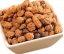 Organic dried tigernuts (chufa nuts) in bowl - gluten-free superfood snack